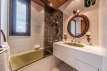A bathroom with a sink and a mirror that says barnes international