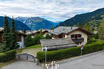 A house with a no parking sign in front of it