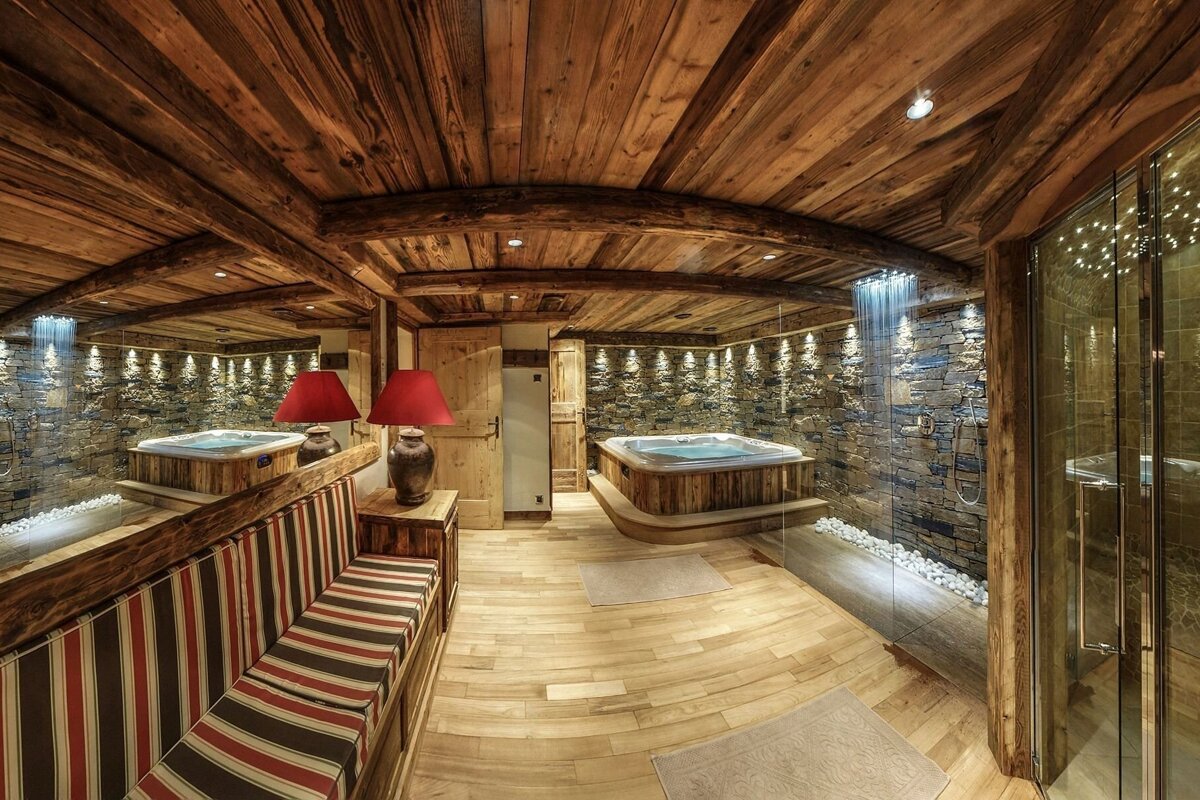 A bathroom with a jacuzzi and a striped bench