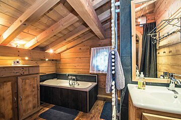 A bathroom with a bathtub and a sink