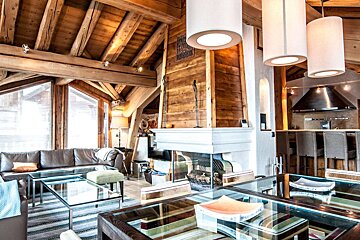 A living room with a fireplace and a couch