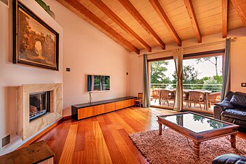A living room with a fireplace and a flat screen tv