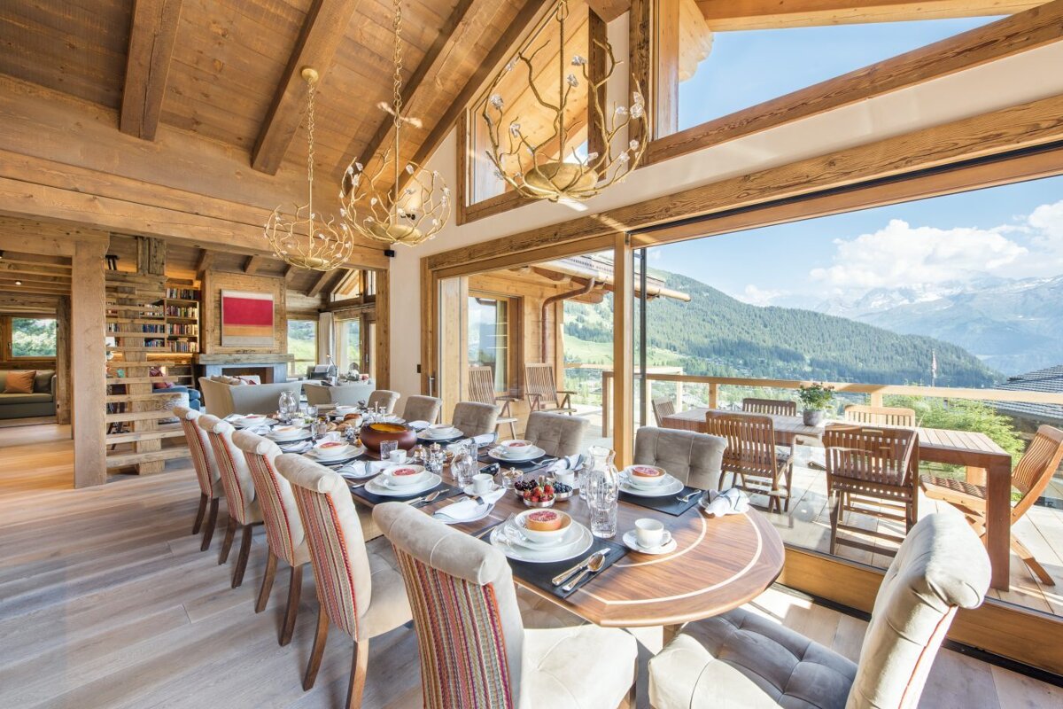 A large dining room with a view of the mountains