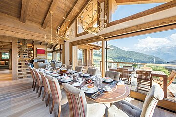 A large dining room with a view of the mountains