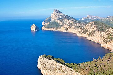 A large body of water with mountains in the background