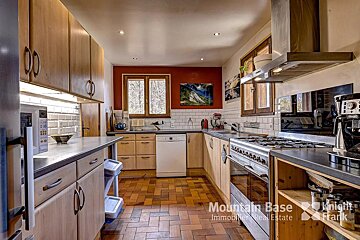 A kitchen with a sign that says mountain base