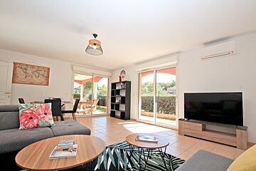 A living room with a couch and a flat screen tv