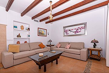 A living room with two couches and a glass coffee table