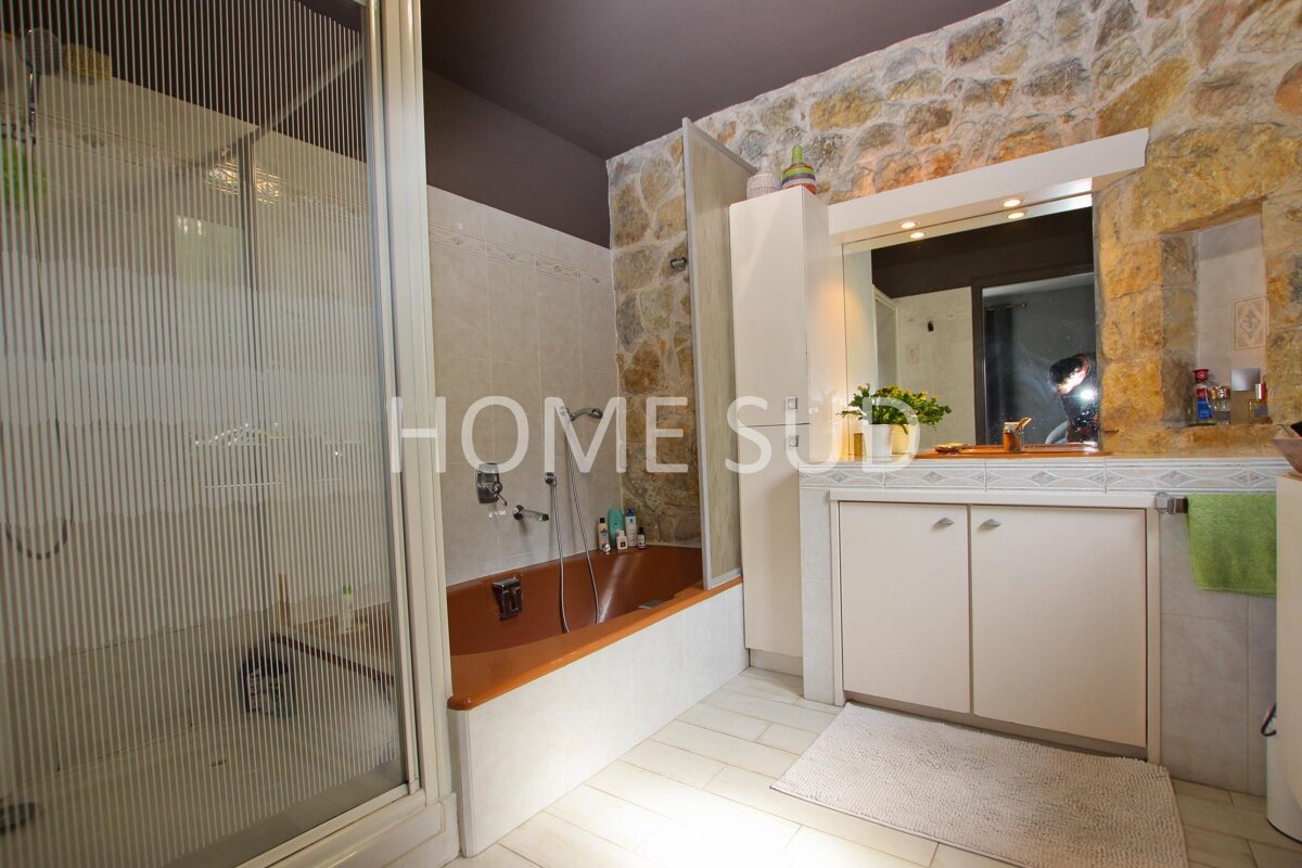 A bathroom with the word home on the wall