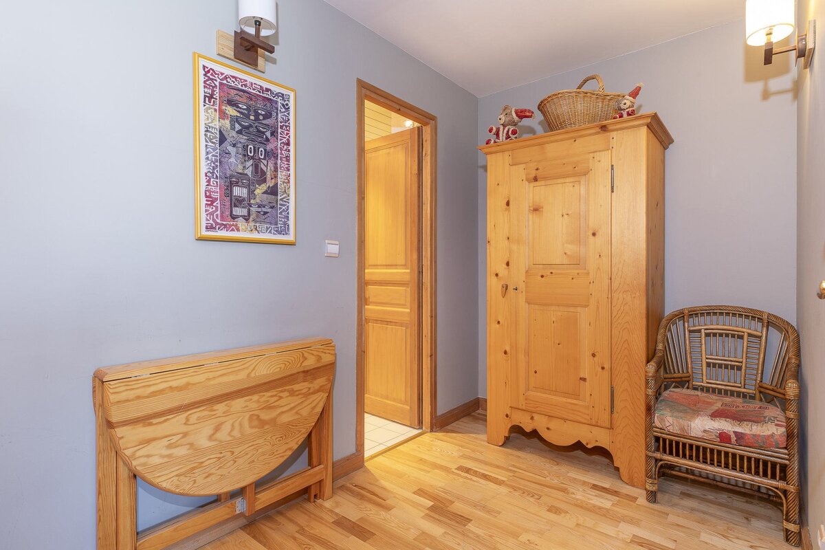 A bathroom with a sink and a yellow mirror