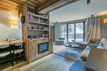 A living room with a couch that says eat ski on it