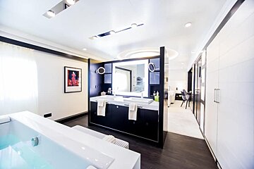 A bathroom with two sinks and a bathtub
