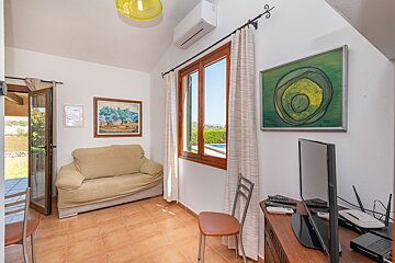 A living room with a couch and a television