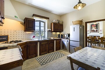 A kitchen with a sign that says
