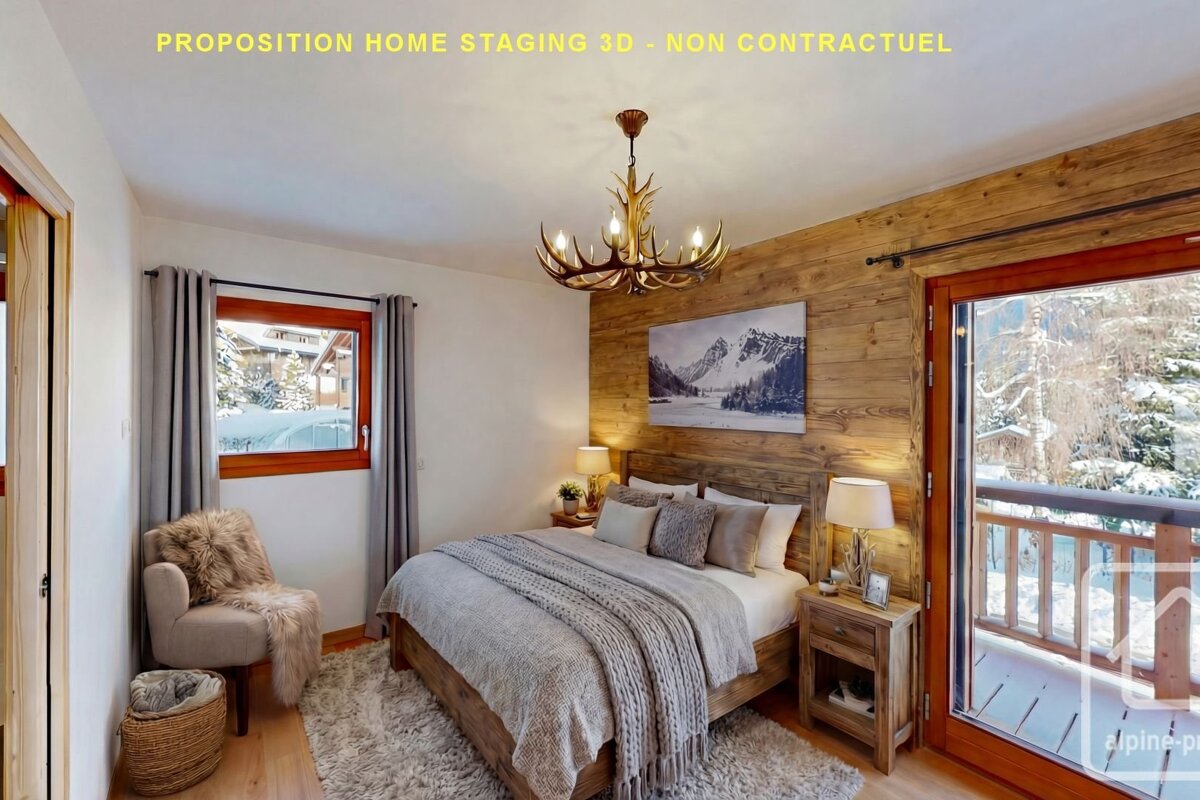 Cozy mountain-style bedroom with a wooden bed, antler chandelier, accent wood wall, and glass door opening to a snowy balcony.