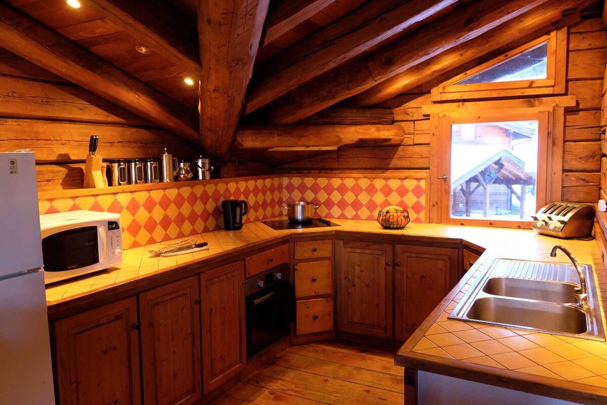 A kitchen with a lg refrigerator and a microwave