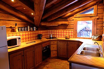 A kitchen with a lg refrigerator and a microwave