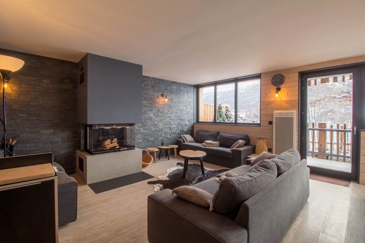 A living room with a fireplace and a couch