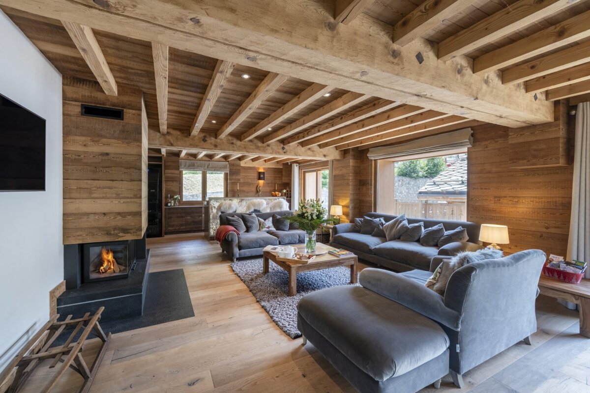 A living room filled with furniture and a fireplace