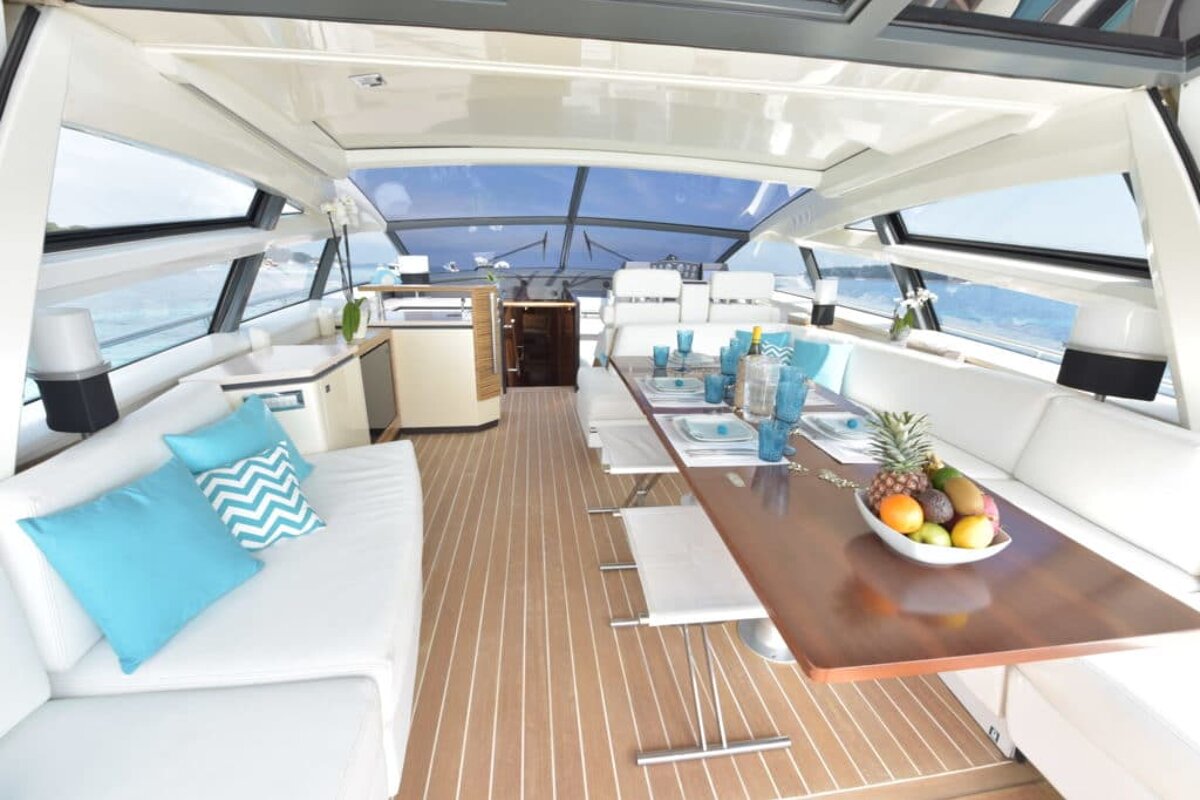 The inside of a boat with a table and couch