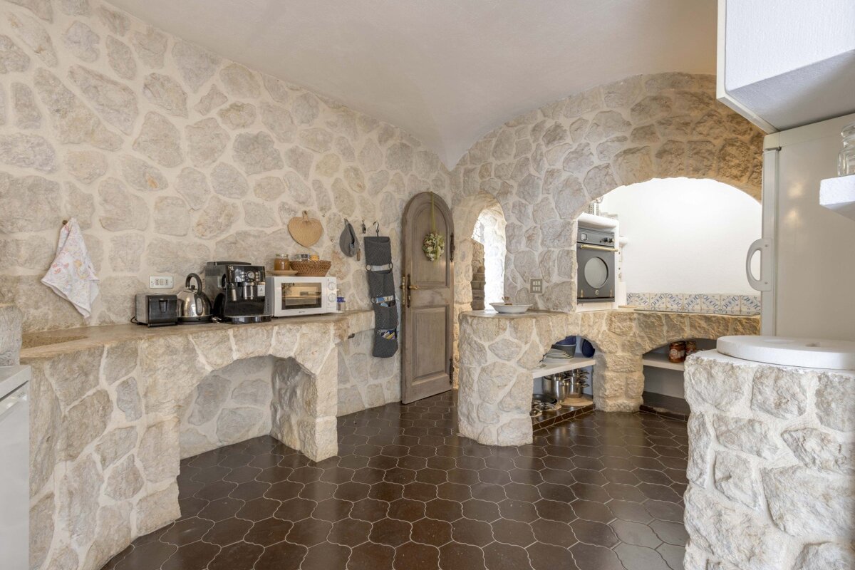 A kitchen with a microwave and a coffee maker