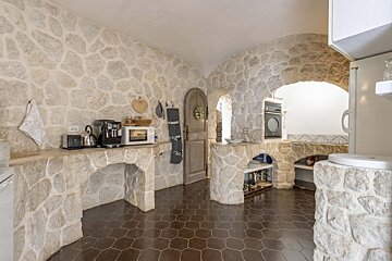 A kitchen with a microwave and a coffee maker