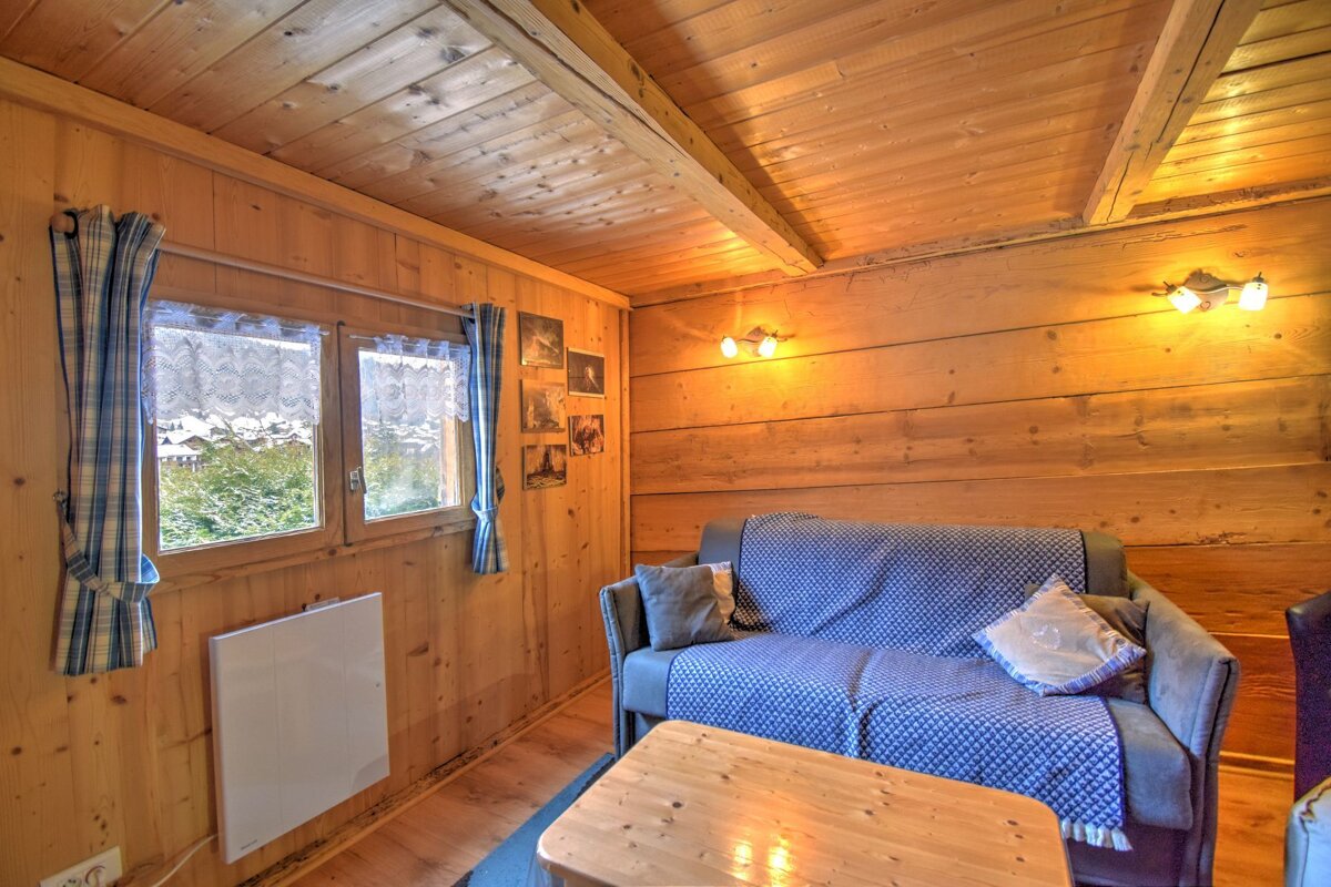 A living room with a couch and a table