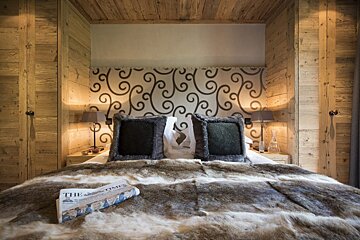 A bed with a newspaper on it that says the times