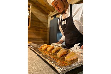 A man in a chef 's uniform with a name tag that says ' amanda ' on it