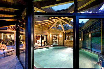 A view of a swimming pool through a sliding glass door