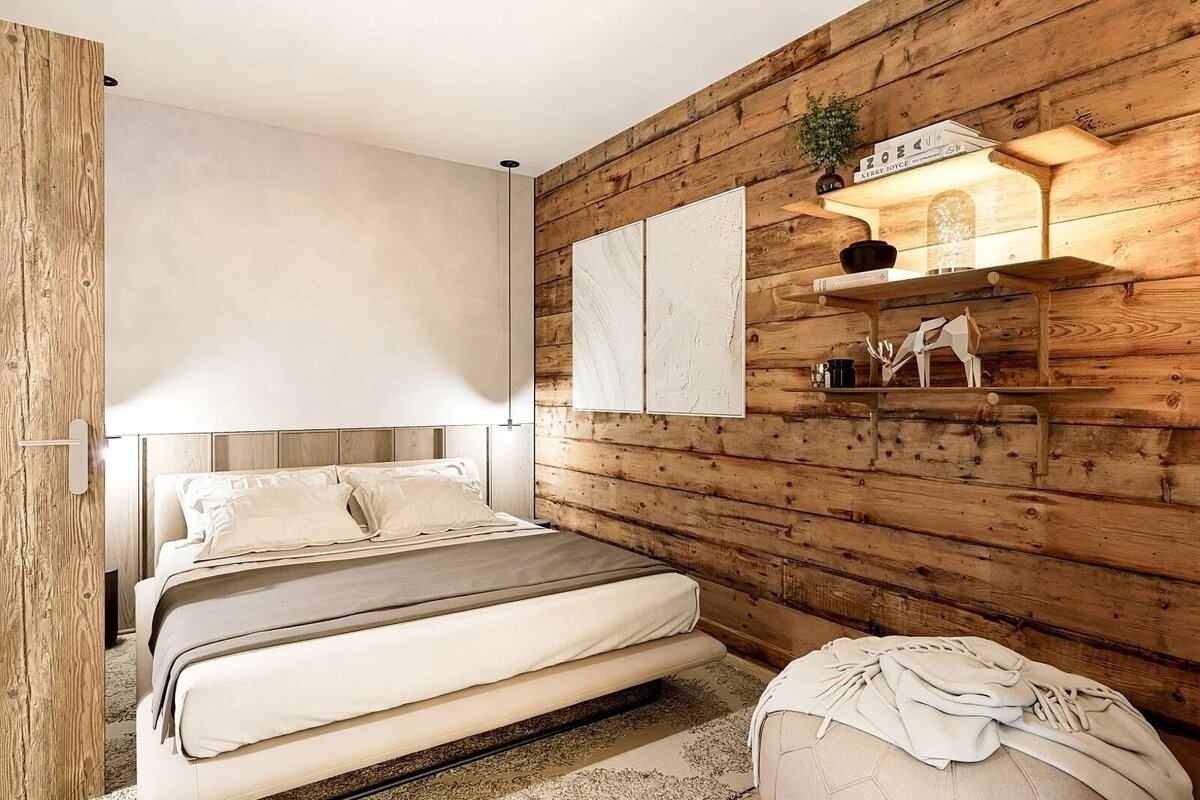 A modern bedroom featuring a prominent rustic wood-paneled wall, a cozy white bed, and illuminated shelves with stylish decor.