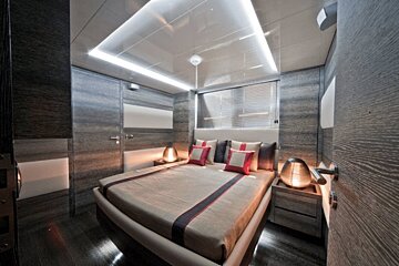 A bedroom with a large bed and two nightstands