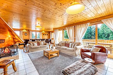 A living room filled with furniture and a fireplace