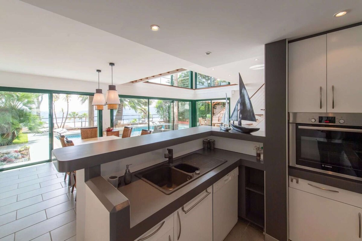 A kitchen with a sink and a bosch oven
