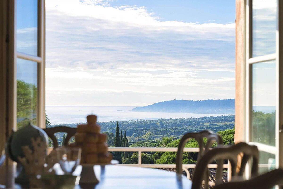 A view of the ocean from a dining room table