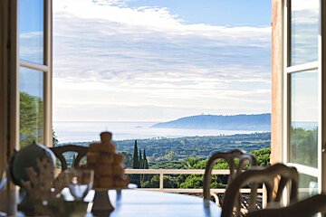 A view of the ocean from a dining room table