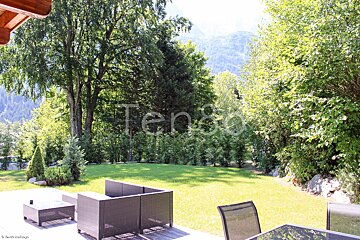 A view of a lush green field with the word ten80 on the bottom