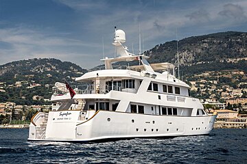 A large white yacht with the name skyfall on the back