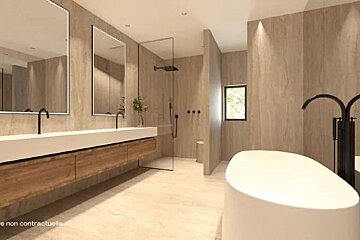A bathroom with two sinks , a tub , and a shower