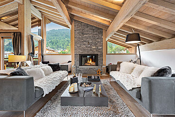 A living room filled with furniture and a fireplace