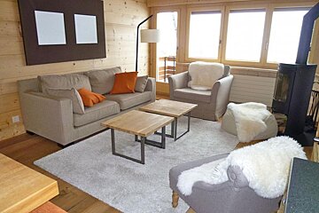 A living room with a couch and a chair