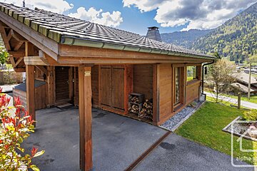 A wooden house with the word alpine on the bottom right