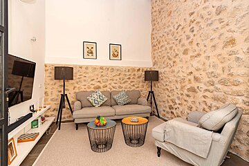 A living room with a couch and two tables