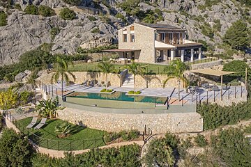 An aerial view of a house with a swimming pool