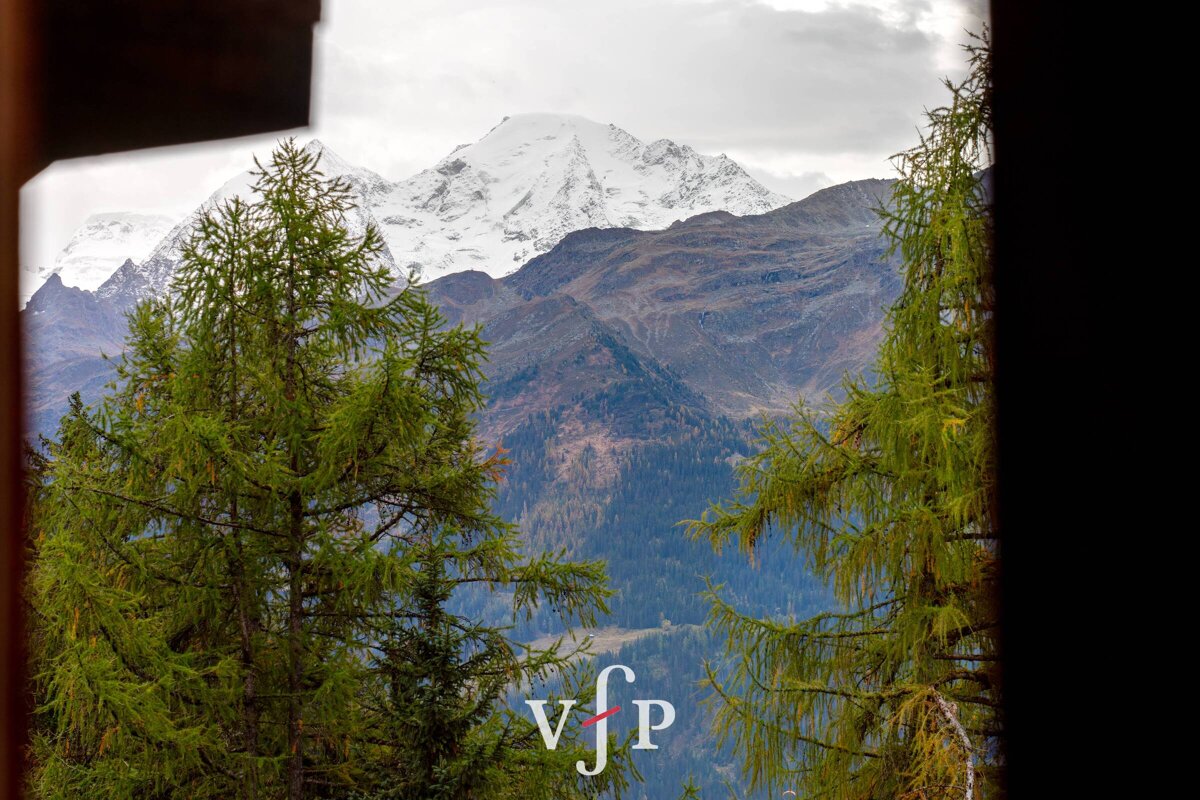A view of a mountain range with the letters vjp on the bottom