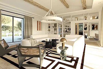 A living room with a couch , chairs , tables and a rug