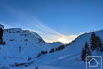 A picture of a snowy mountain taken by alpine property