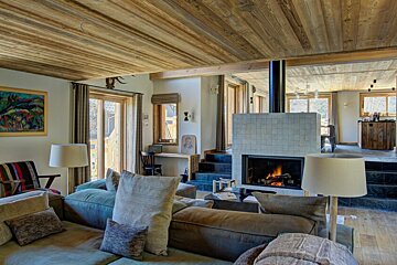 A living room with a fireplace and a couch