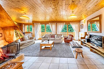A living room filled with furniture and a fireplace