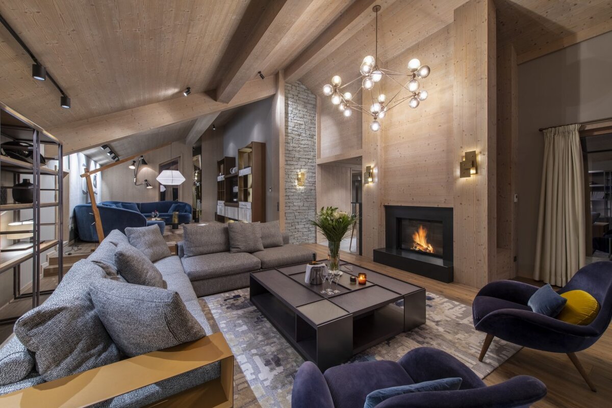 A living room filled with furniture and a fireplace